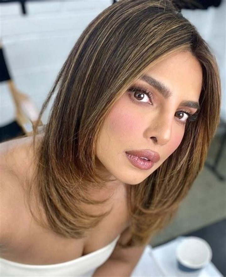 10 Fall 2023 Haircut Trends, From The Butterfly Bob To Midi Bangs