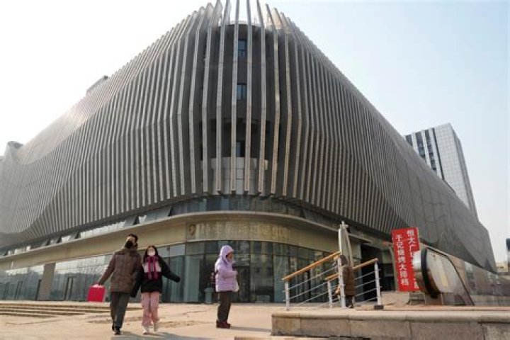 China pledges more help for its ailing property market, as IMF forecasts economy will slow