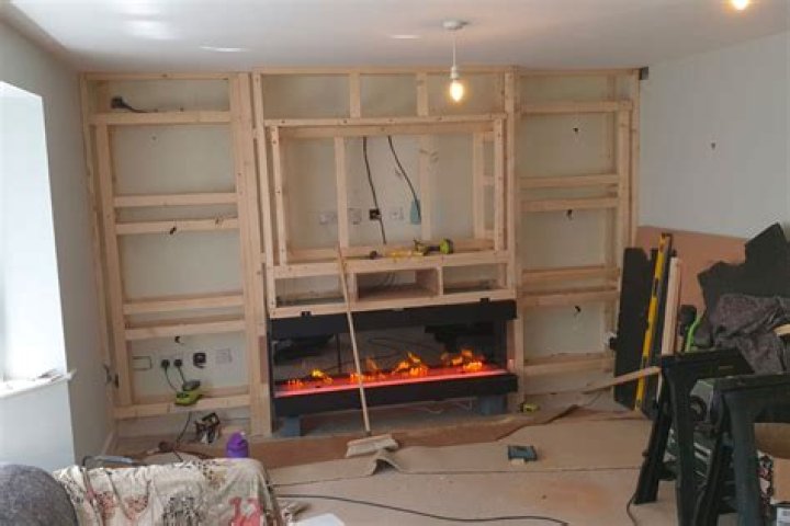 DIY fans are building stunning chimney breasts in their living rooms for their TVs & they say it makes rooms seem BIGGER