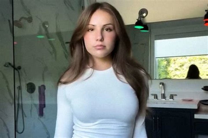 Ebanie Bridges sends fans into meltdown by posing in barely-there plunging white outfit and teases her OnlyFans account