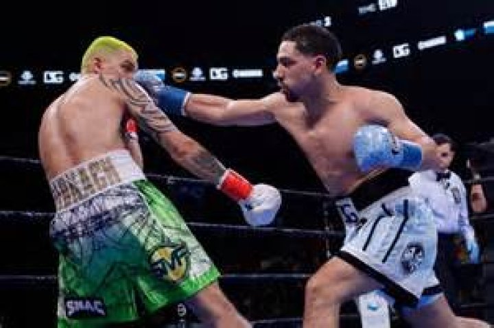 Garcia earns 12-round decision, overcomes bite by Redkach