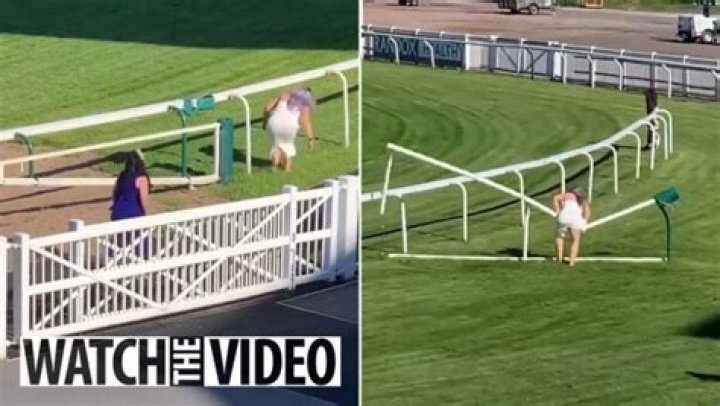 Hilarious moment two women invade race track and try to jump rail…but it all goes wrong