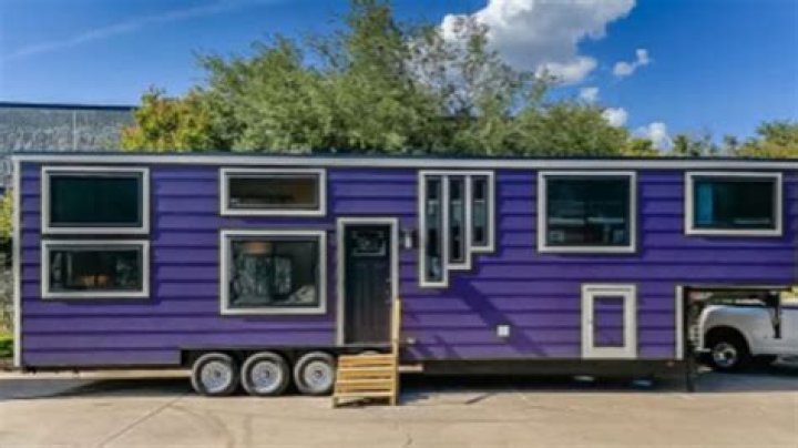 Inside crazy two-story purple caravan worth £100,000 with three bedrooms, a copper sink and a proper front door