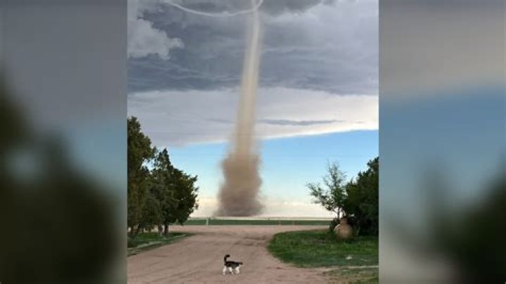 Jaw-dropping moment giant 'landspout' tornado towers over desert landscape in dramatic video