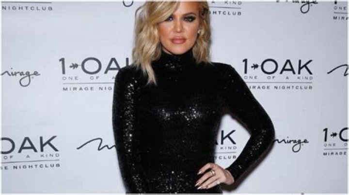 Khloe Kardashian embraces her hands in a photo after clapping back on Instagram
