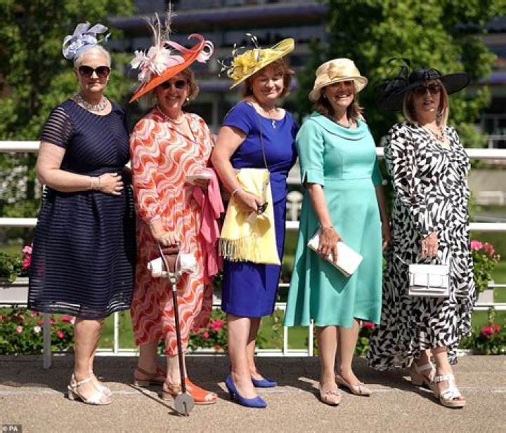 Stylish racegoers pull out all the stops at Epsom racecourse for Ladies' Day with glam dresses and eye-catching hats