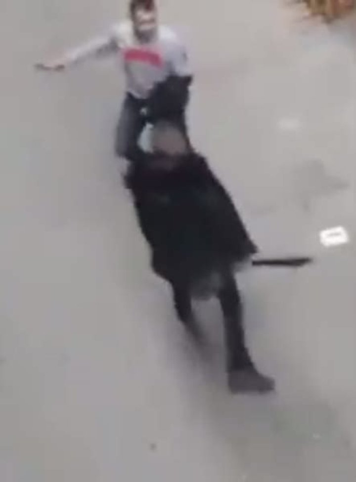 Terrifying moment two men wield machetes and knives in Barcelona brawl