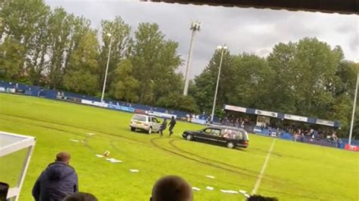 Watch as Gateshead vs Dunston football match descends into chaos when masked men in a HEARSE storm pitch