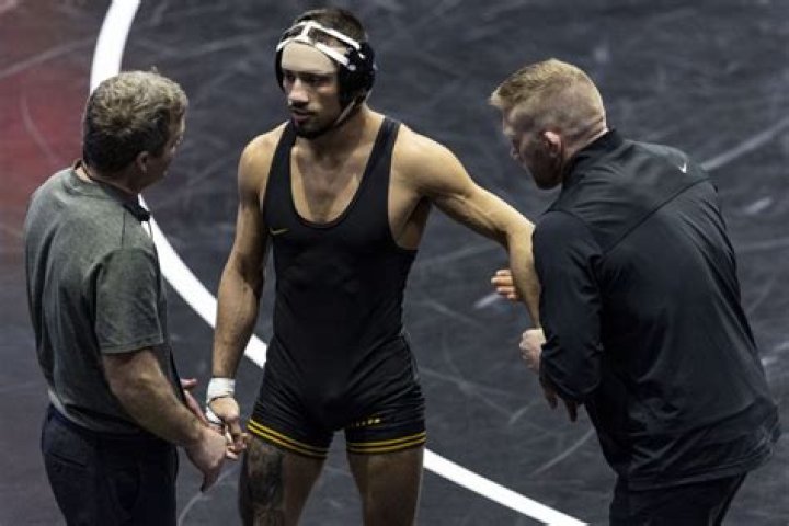 Wrestler fighting leukemia gets special call from Hawkeyes’ Real Woods